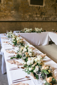 Long, rustic table decorations at French Chateau wedding photography and videography