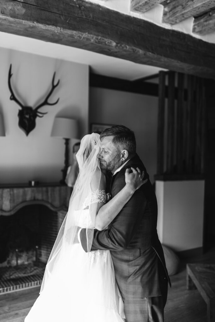 Candid and natural photo of the bride and her dad at French Chateau wedding photography and videography