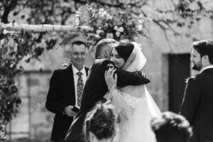 Father of the Bride gives bride away at French Chateau wedding photography and videography