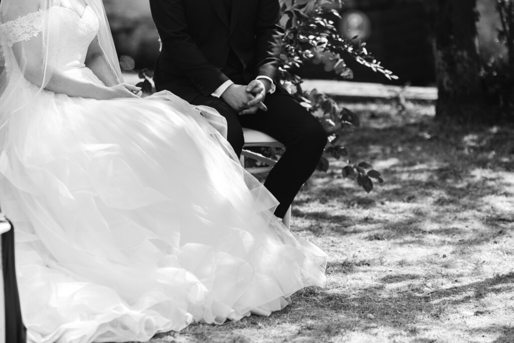Bride and groom hold hands at French Chateau wedding photography and videography