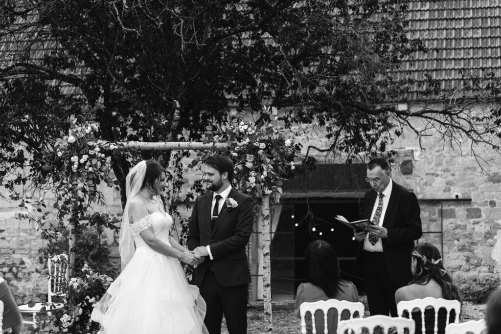 I know pronounce you husband and wife, black and white candid photo