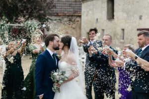 Guests throw confetti after intimate ceremony