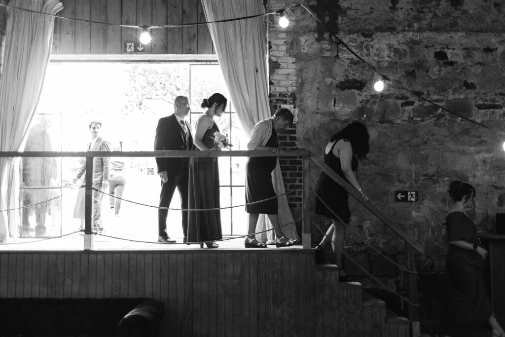 Guests enter wedding receeption during French Chateau wedding photography and videography