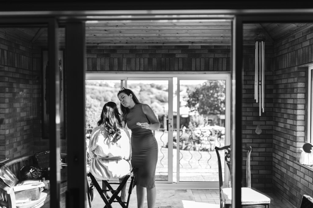 Bride gets makeup done on her wedding day morning