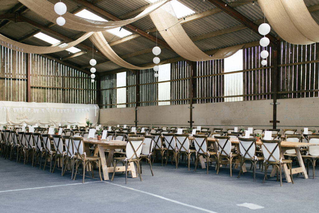 a cowshed that has been cleaned on a family farm in Cornwall ready for the wedding day 