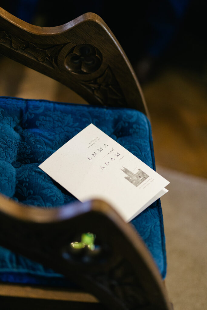 Order of service sits on a chair in the church 