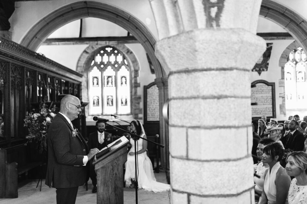 Family member reads in the church on the wedding day 