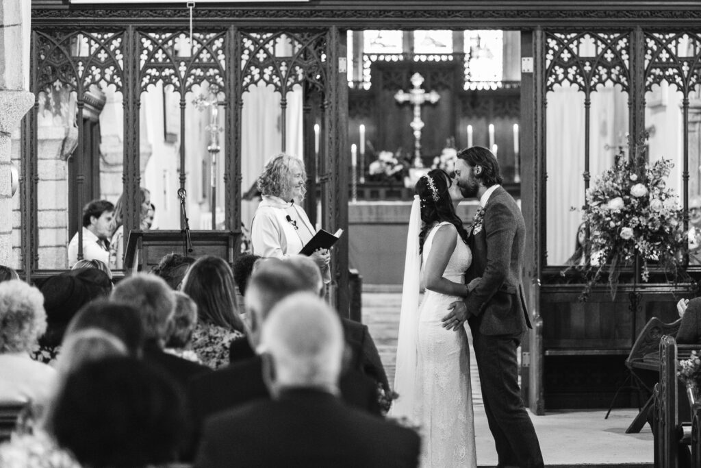 Bride and grooms first kiss