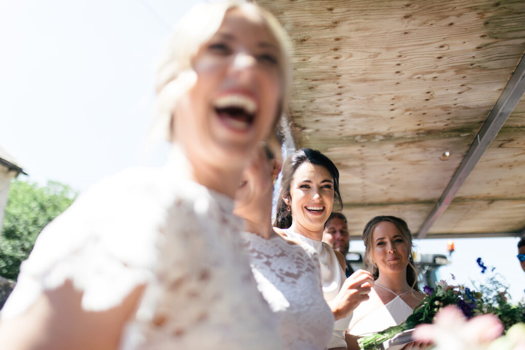 Bridesmaids laugh and smile 