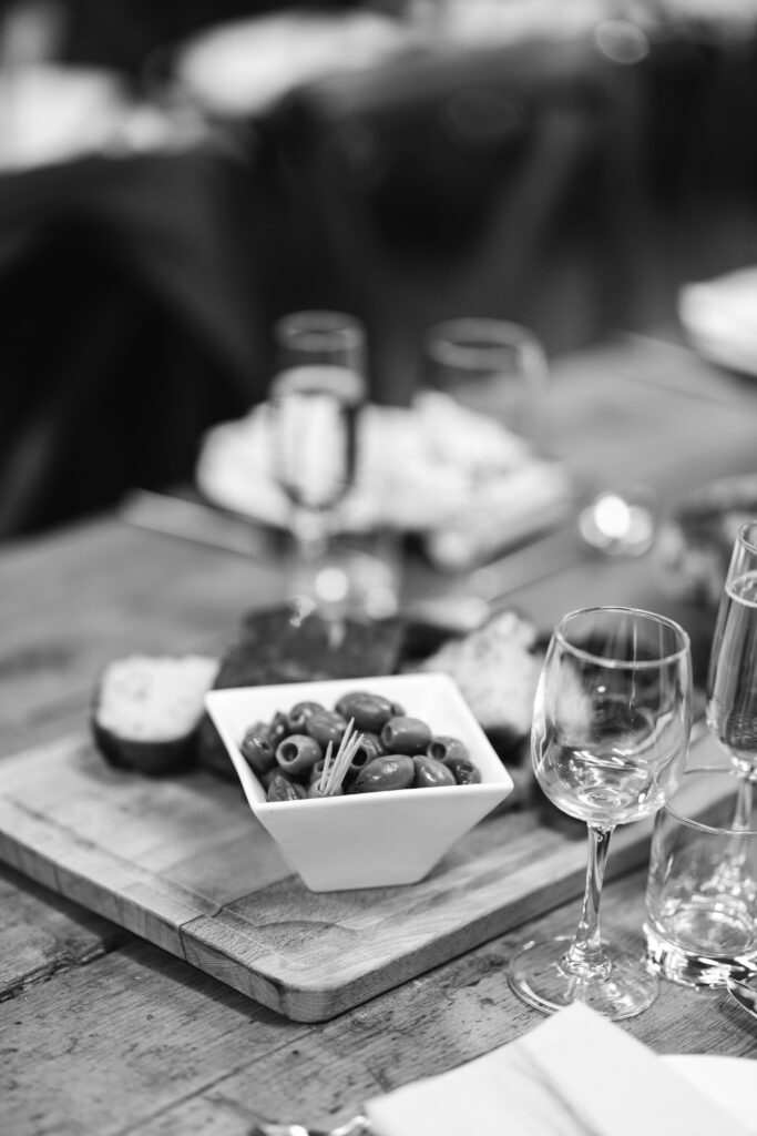 Close up of wine and olives on the table at a wedding reception