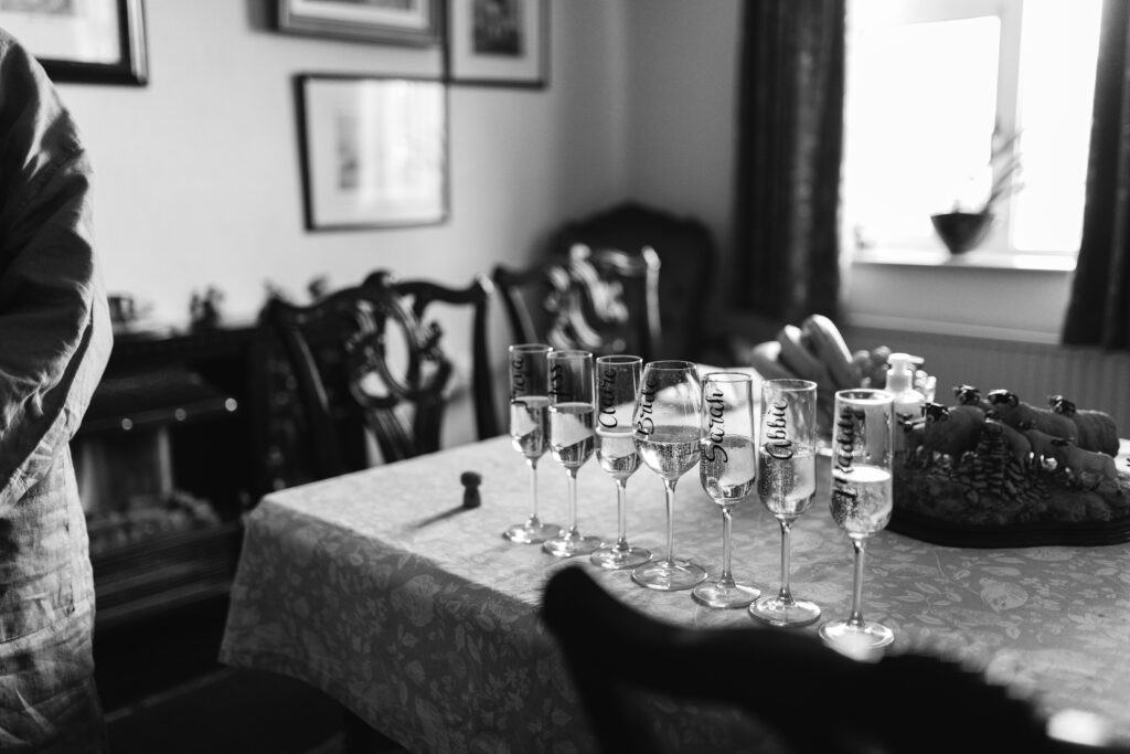 champagne glasses lined up ready to pour on wedding morning 