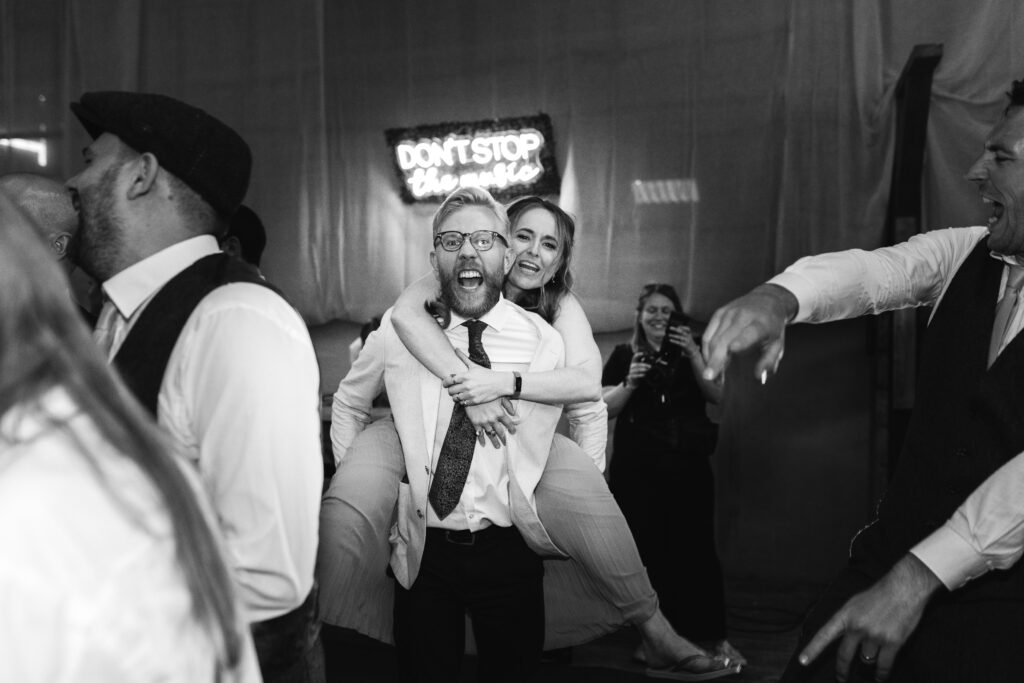 Candid and funny dancefloor photographs at a wedding