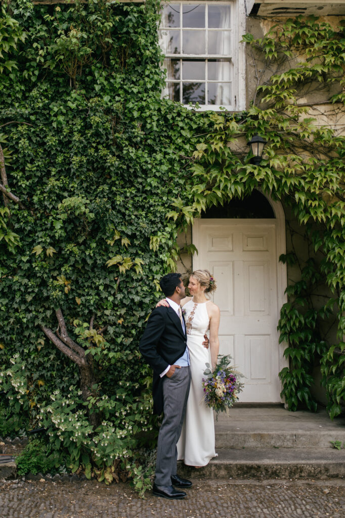 Bride and groom pose for wedding photos on their wedding day 