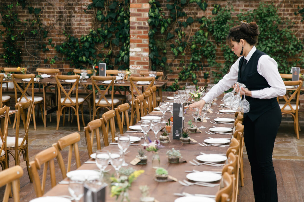 Waitress sets up for wedding day 