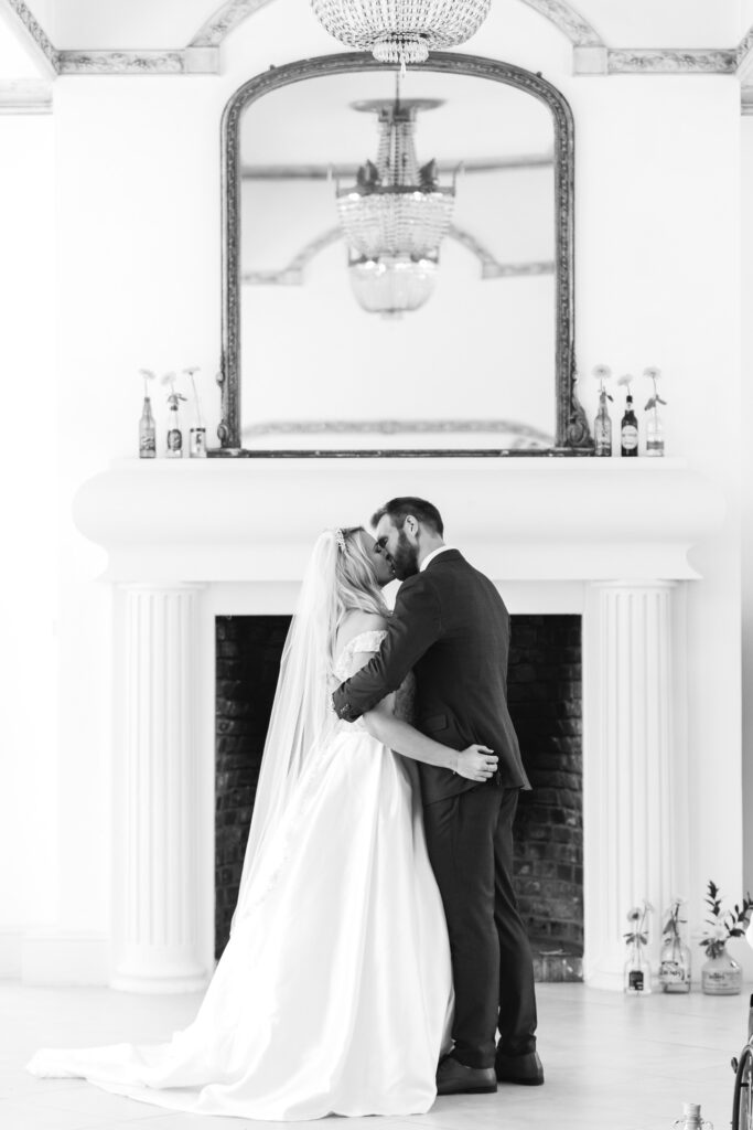 Bride and groom kiss at the alter after being married 