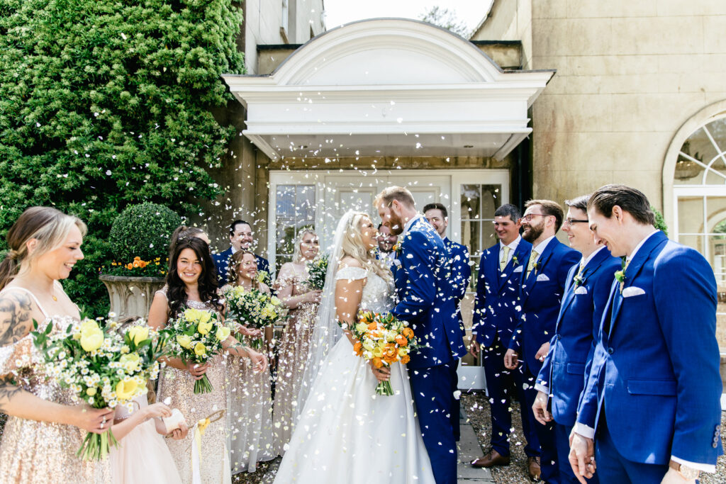 Confetti is thrown over the bride and groom after they are married 