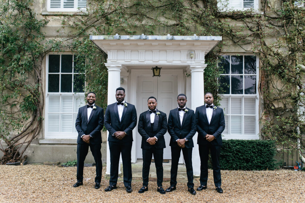 Groomsmen pose for photograph