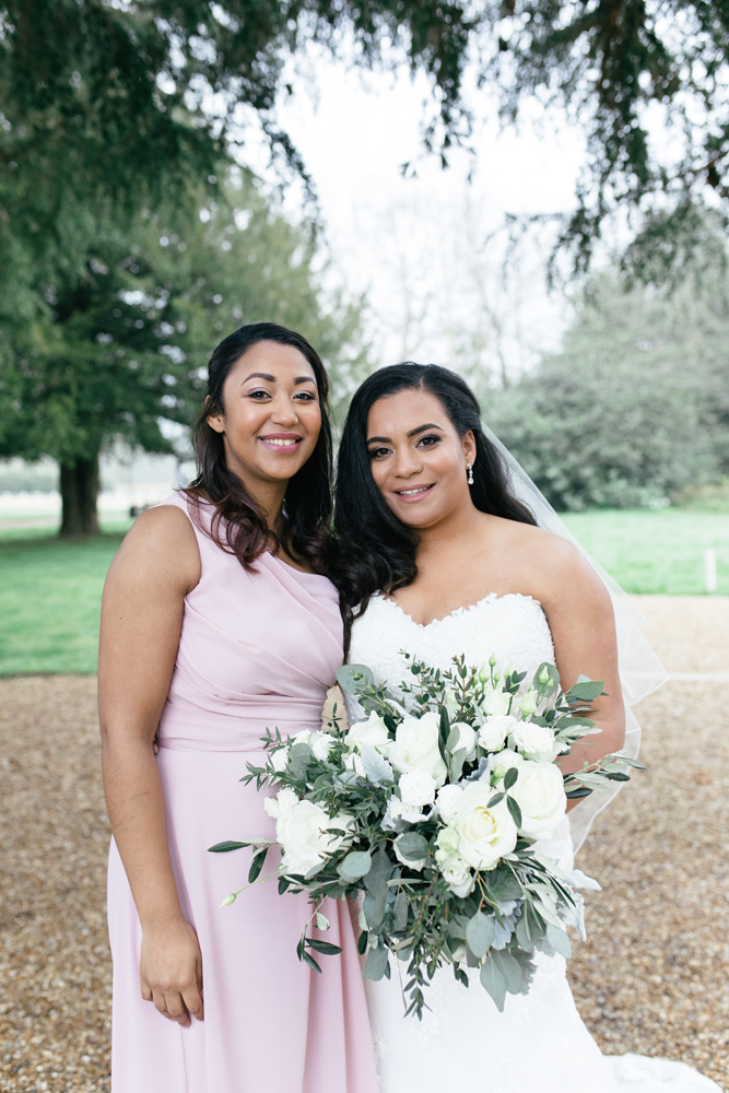 Bride and maid of honour pose for photograph