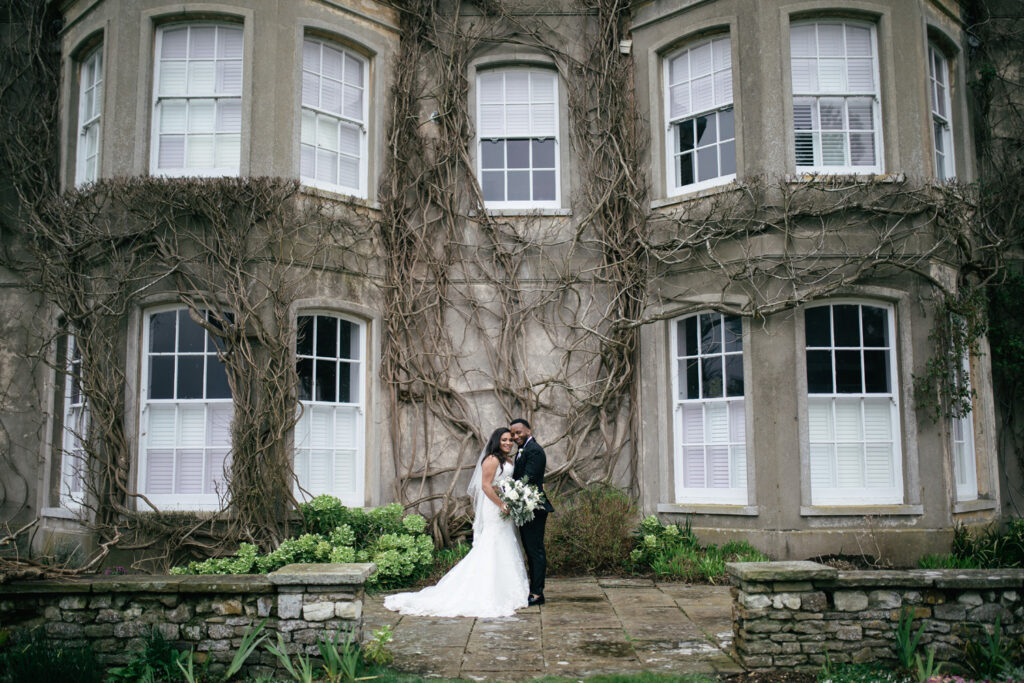 Couple pose outside of Northbrook park during winter wedding 